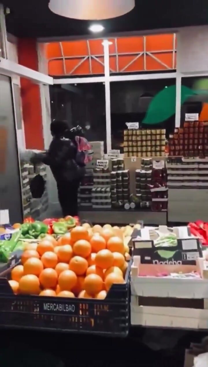 African lady pees on stores floor then damages the st..