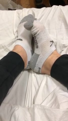 Teen boy feet in puma ankle socks and smooth soles