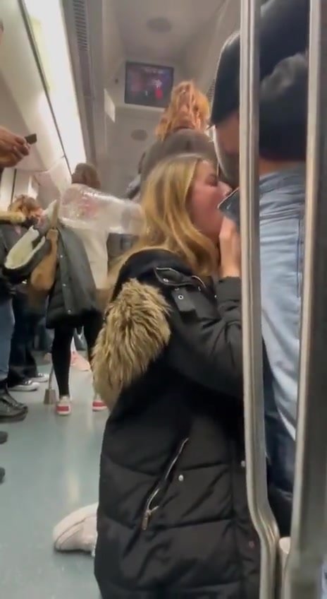 she is sucking his cock in the subway