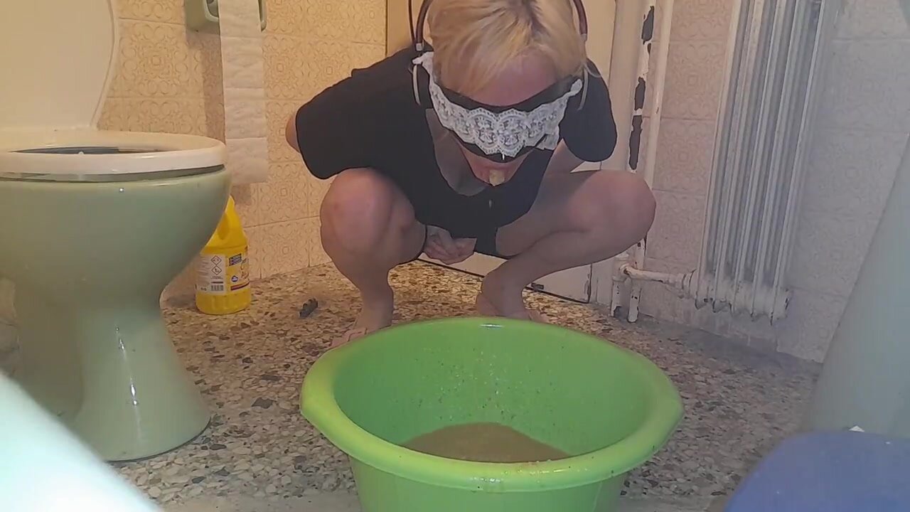 Girl vomits in bucket
