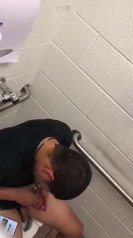 young bul caught beating his dick in the restroom