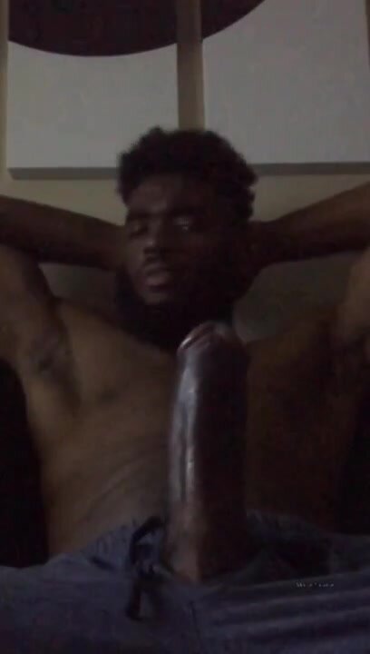 A straight, well-endowed black guy shows off his huge c