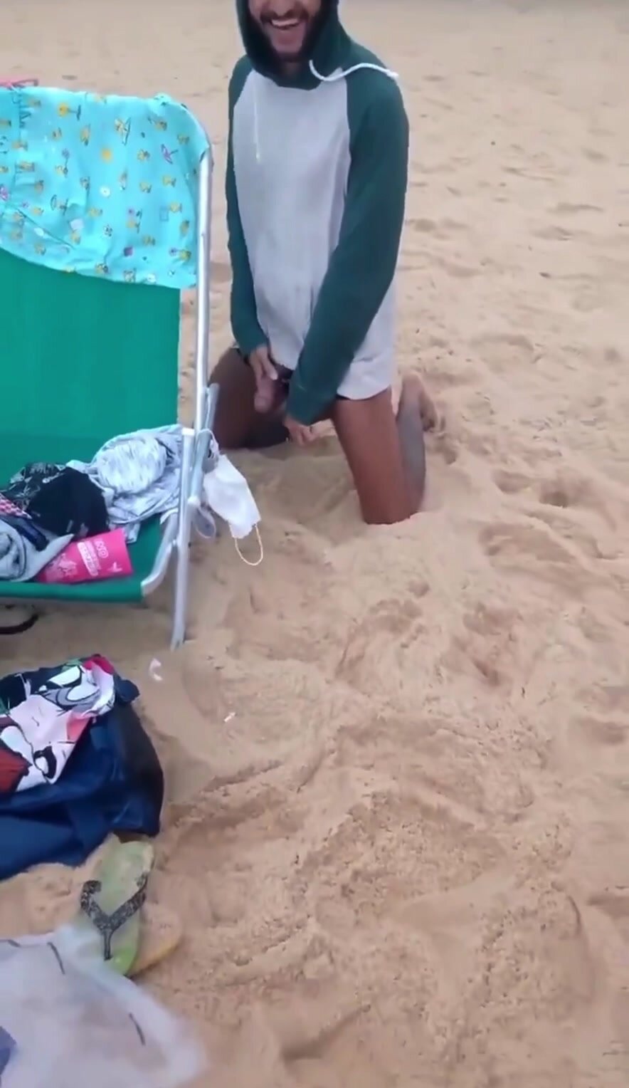 Big dick man is pissing on the beach