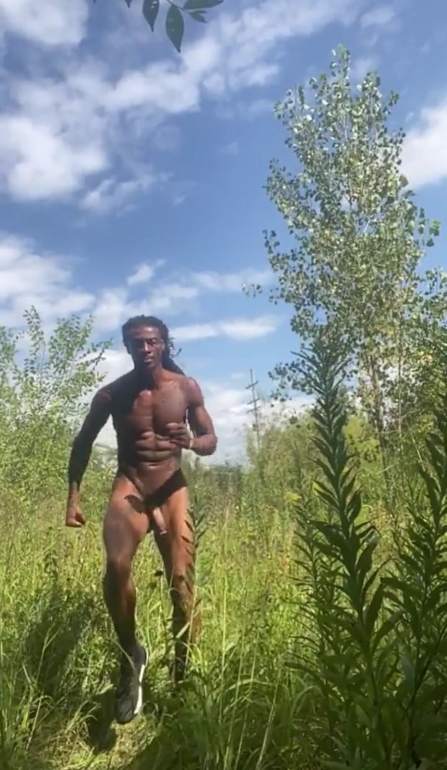 Hung naturist exercising outside