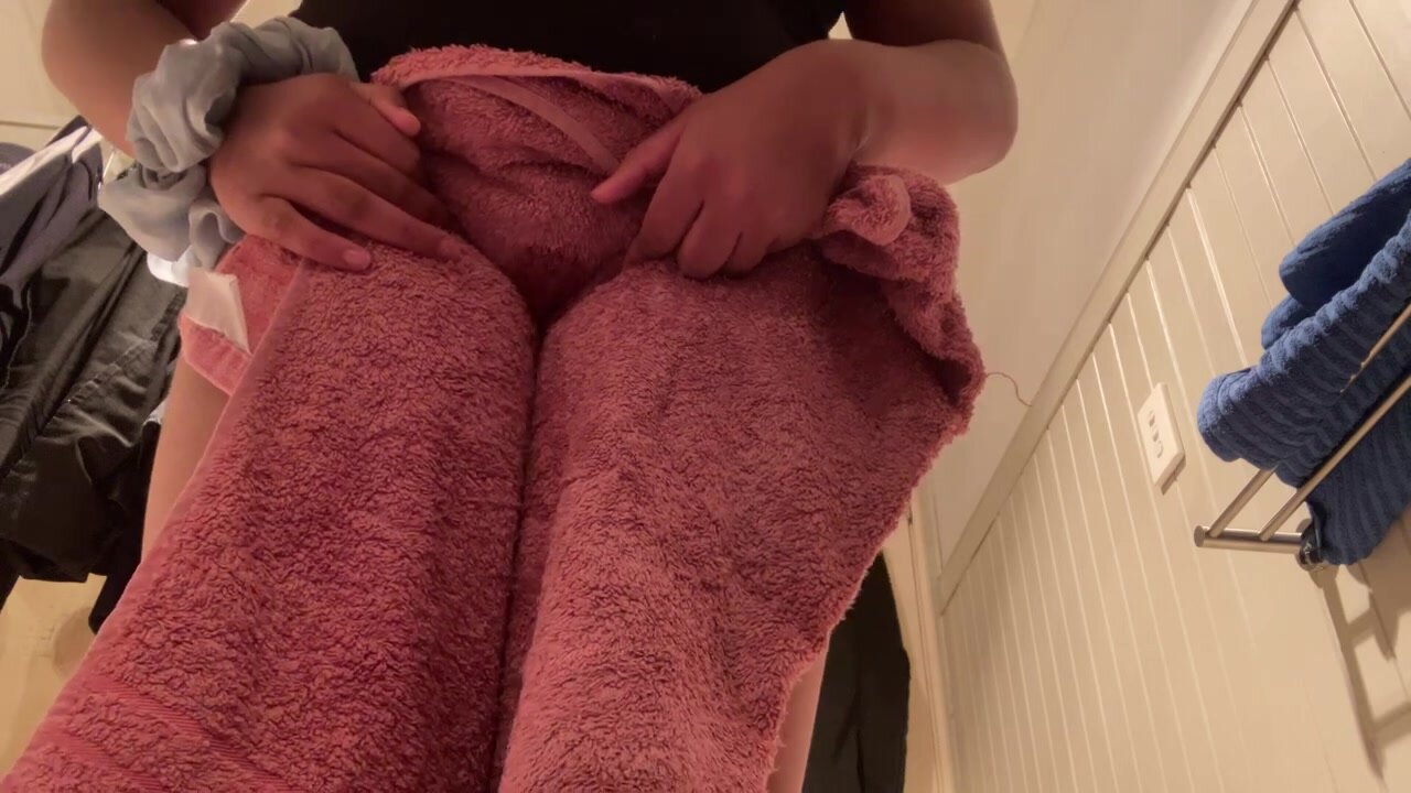 Cute girl pees in towel