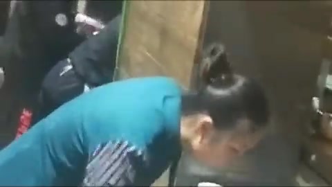 Chinesse woman swallows something