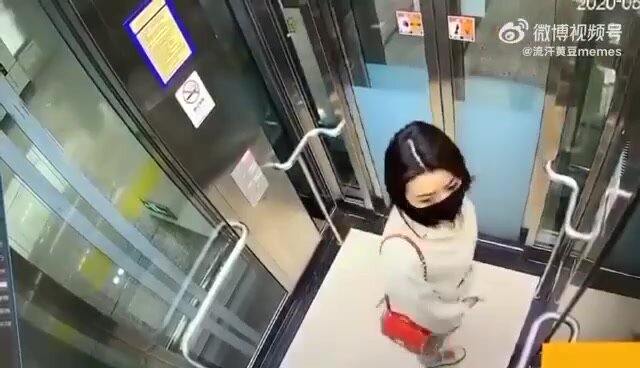 Asian woman shitting in an elevator