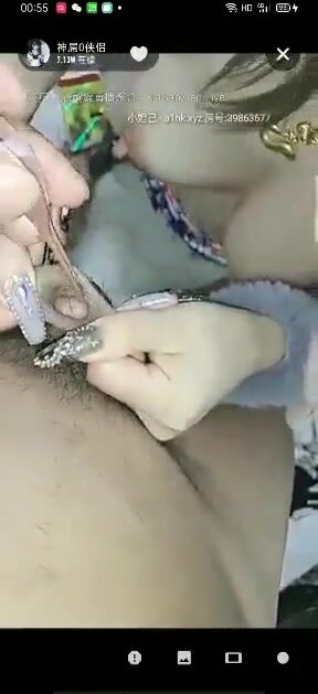 asian woman use a tweezer to catch a micropenis