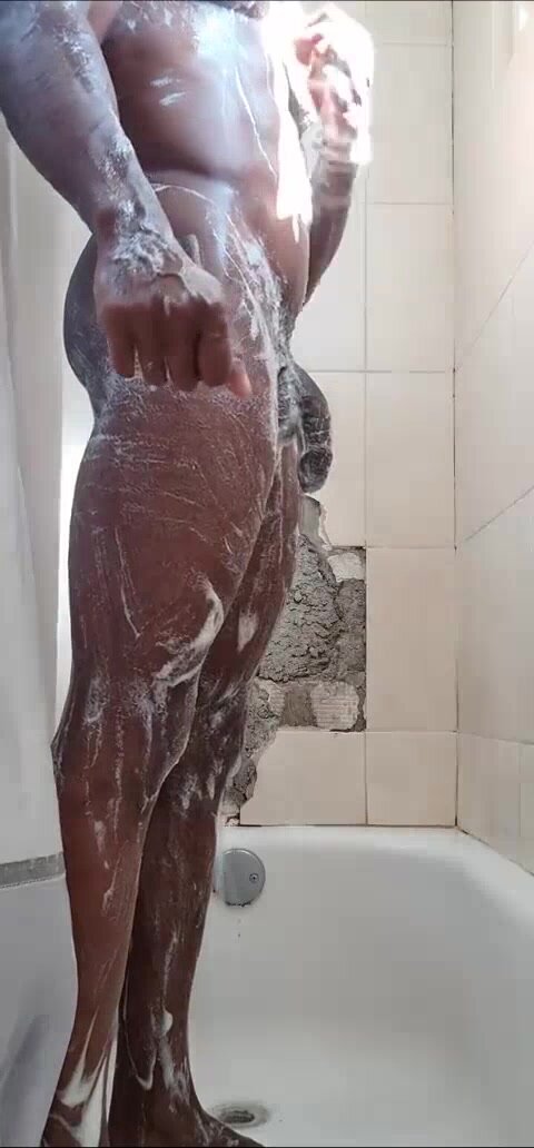 Uncut muscular Jamaican in the shower