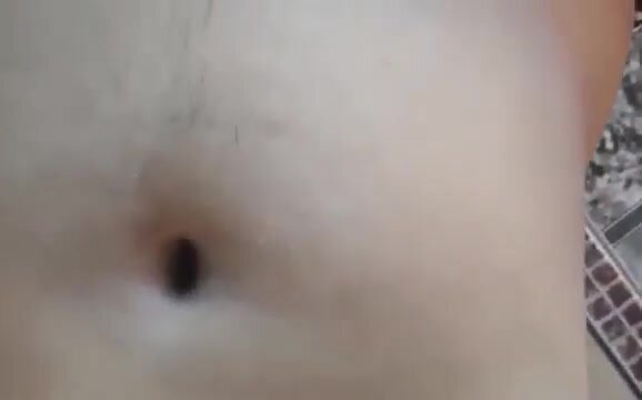 Boy showing off navel