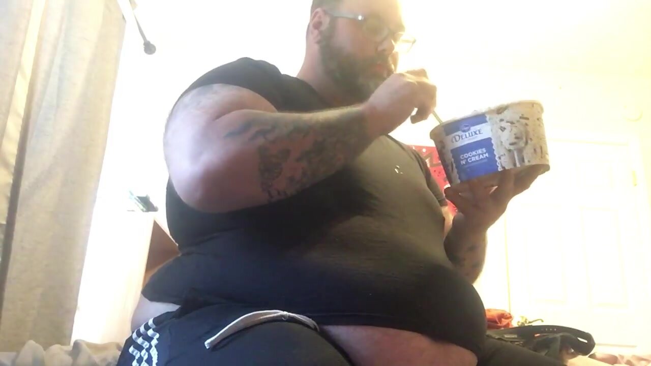 huge fat tatted bear drinks melted ice cream