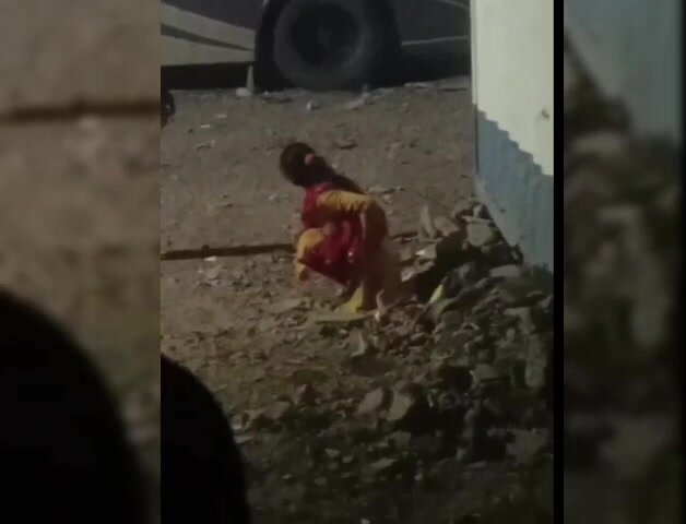Aunty open Pissing in bus stand