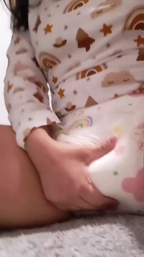 squishing in her full diaper