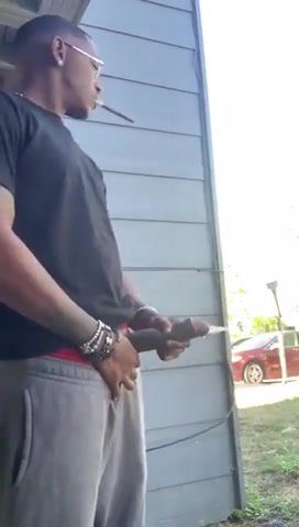 Hung black dude pissing in his yard