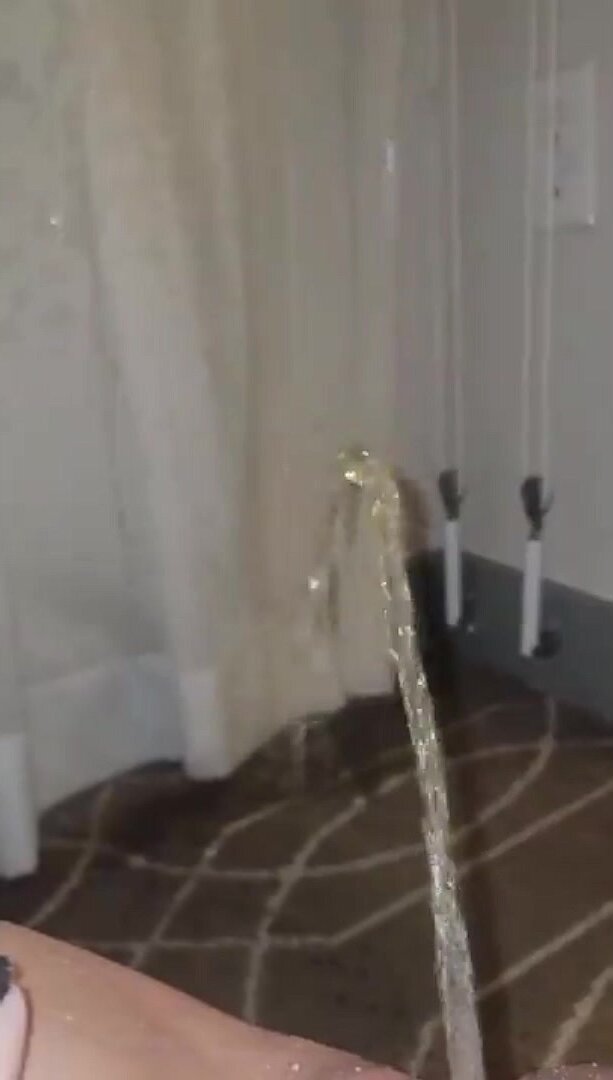 Girl pissing on a curtain and carpet!