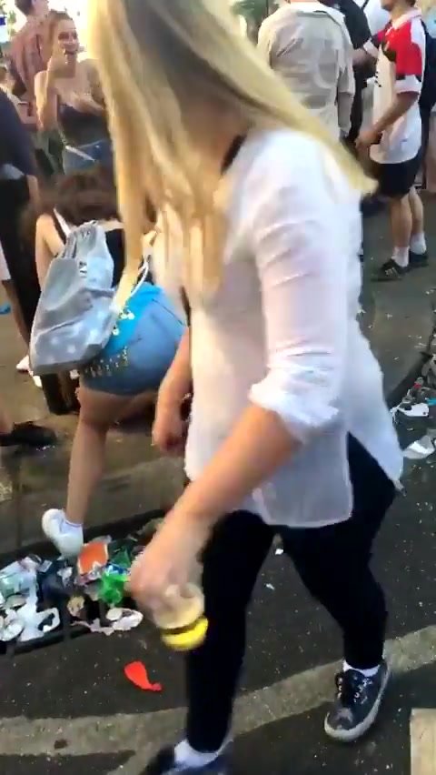 Girl peeing on the crowded street
