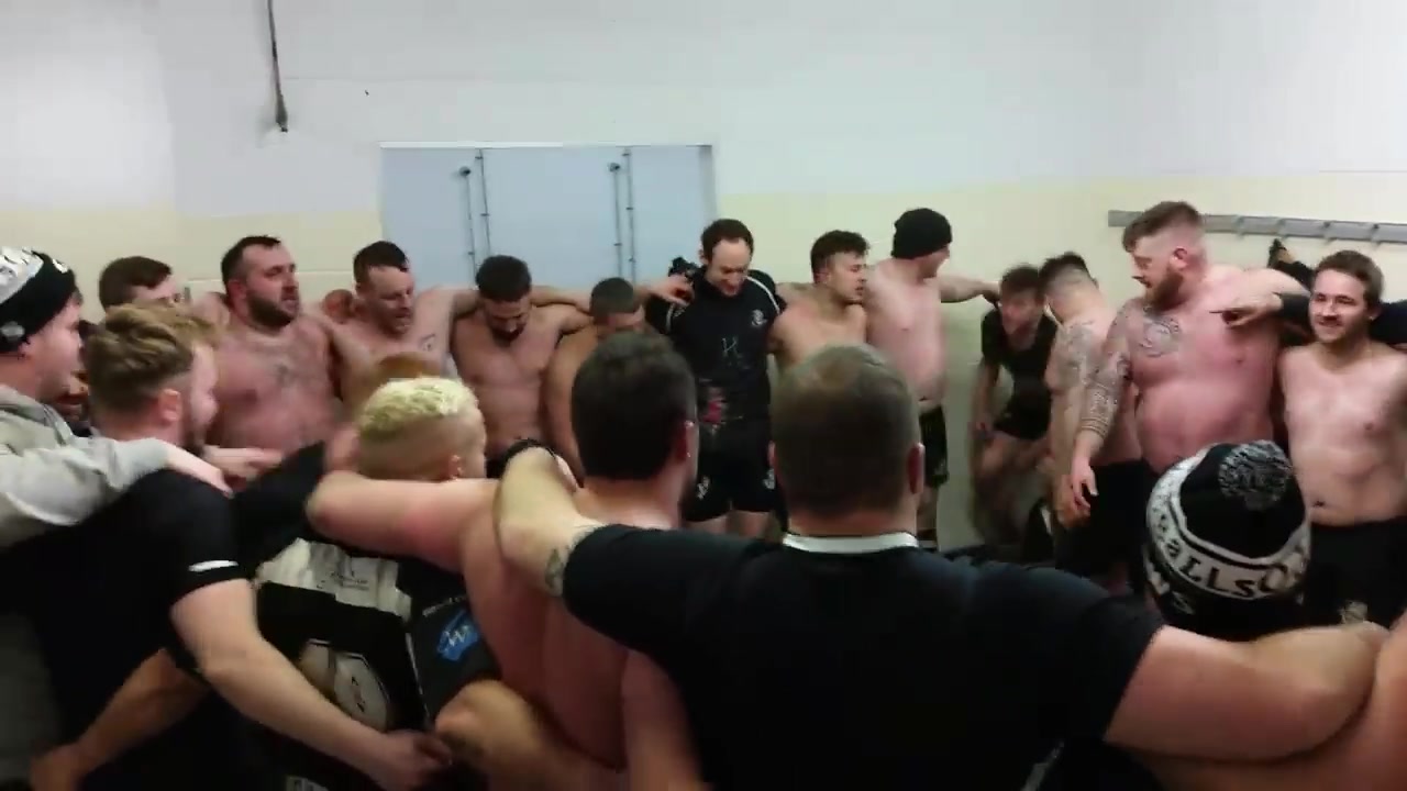 Rugby players sing naked