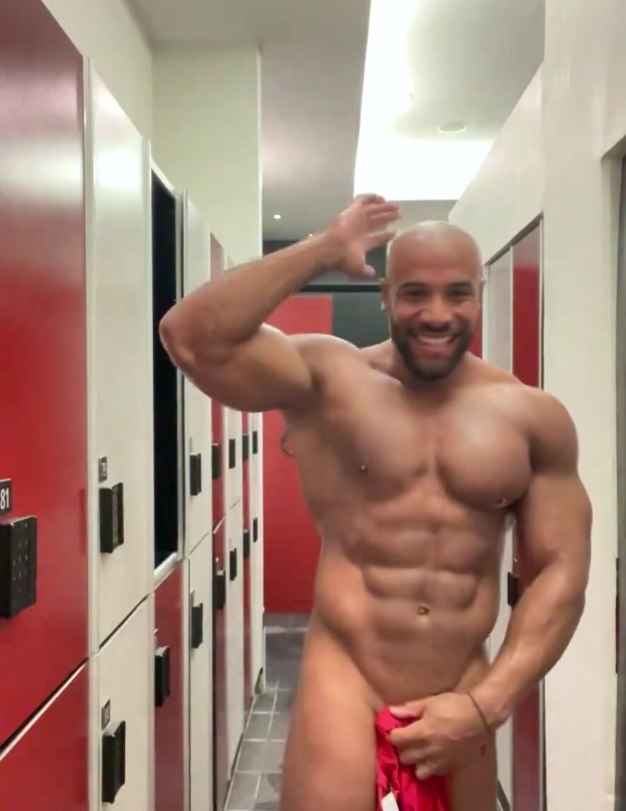 Handsome bodybuilder naked in locker room
