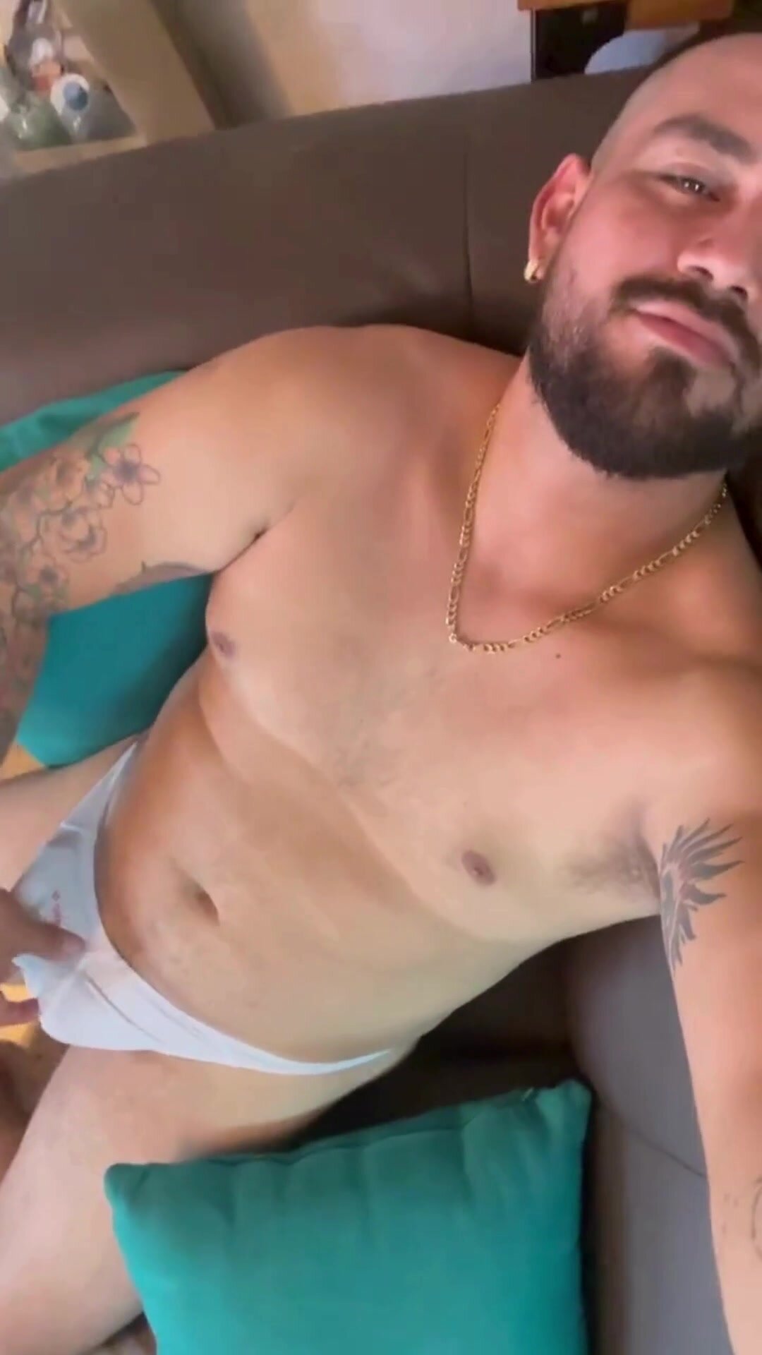 Beefy guy shows off his hairy pits and big bulge