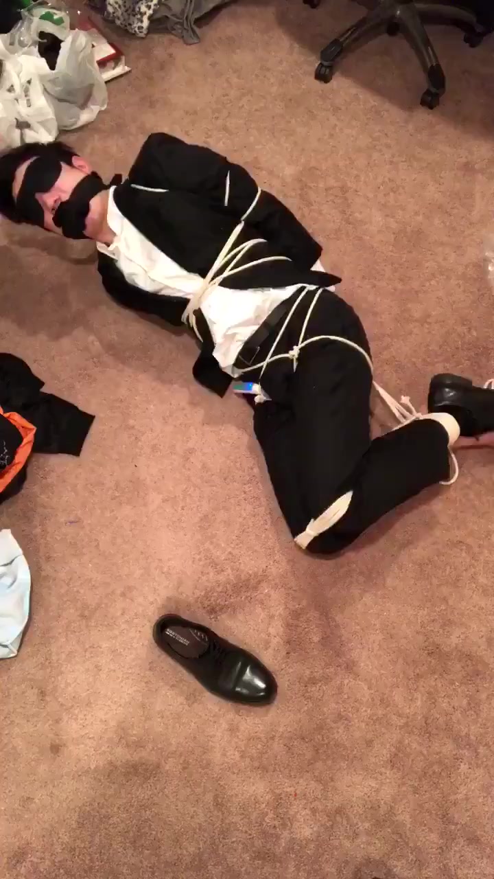 chinese suit guy bound and gagged