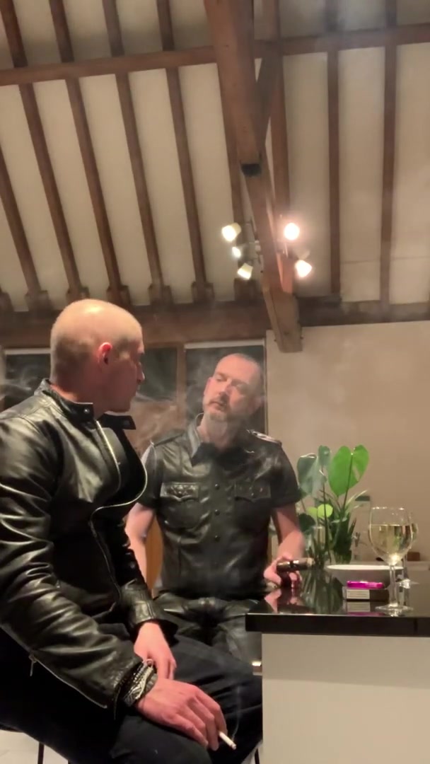 smoking in leather and kissing