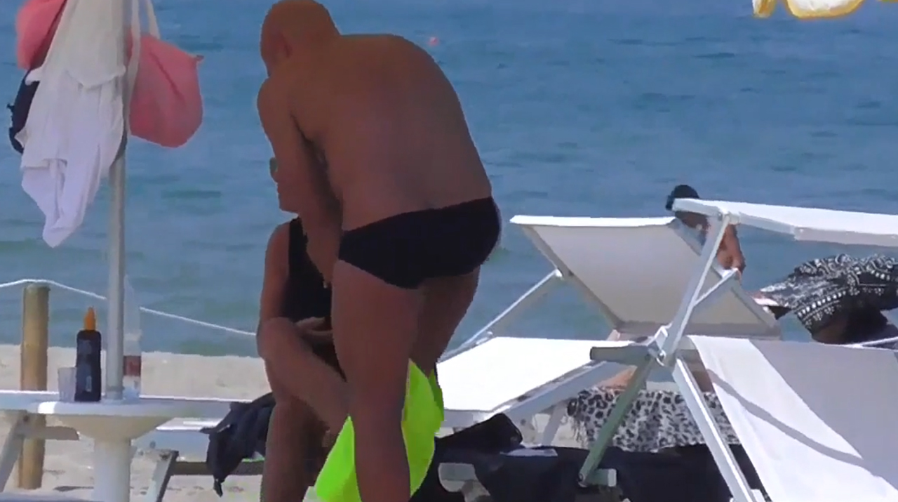 Italian male in solid black skimpy speedos Dychh