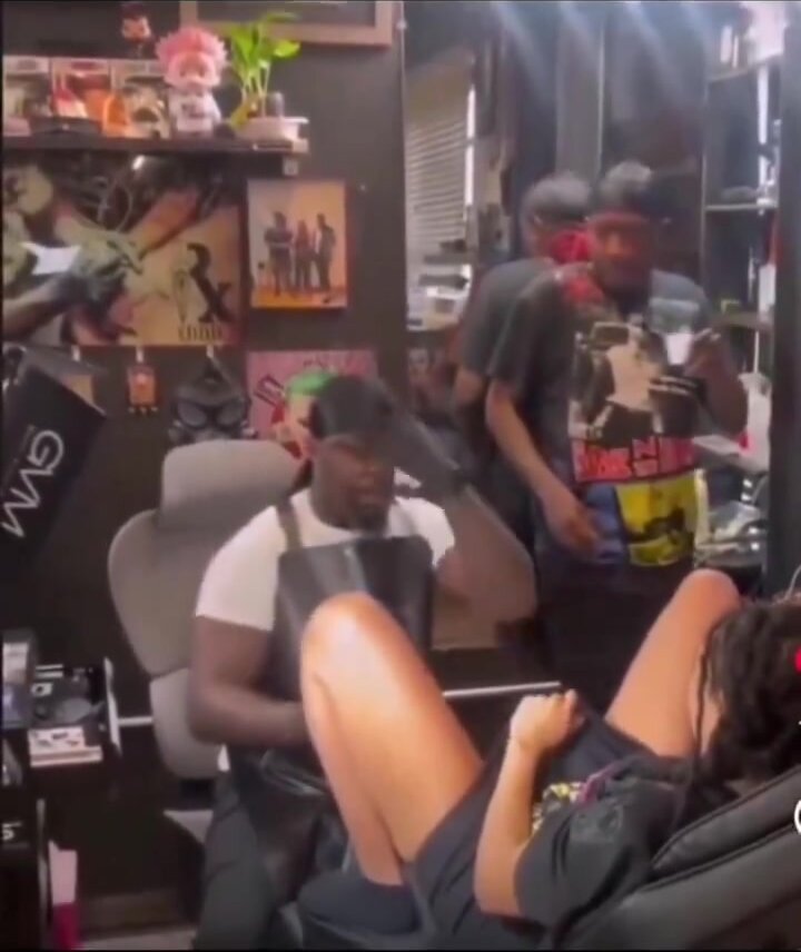 Ebony sprays the tattoo artist