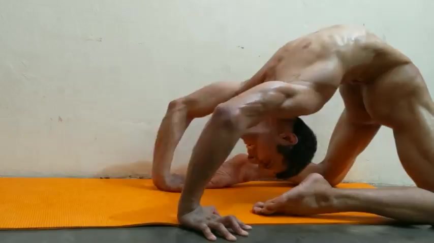 Nude Contortionist in Extreme Backbend
