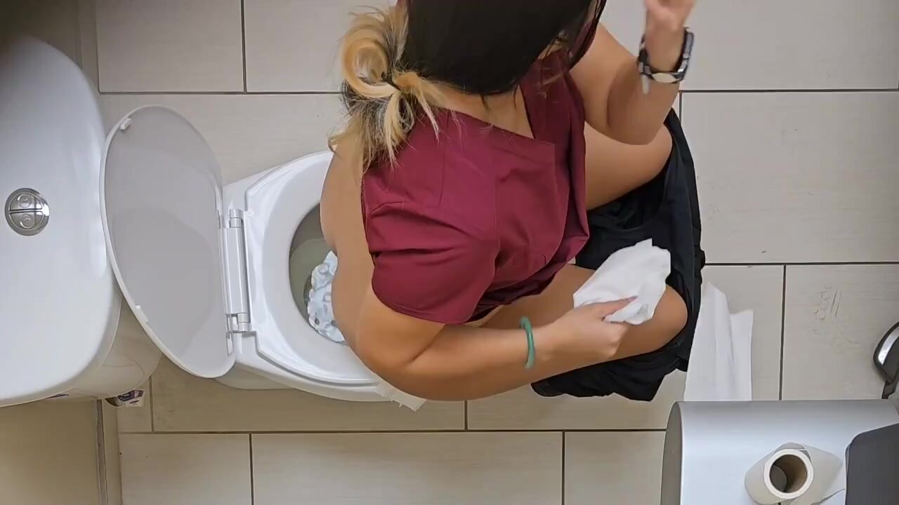 Overhead ceiling cam watches nurse pee in the toilet