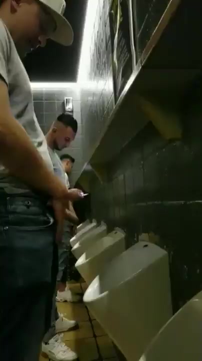 GREAT BOY PISSING AT URINAL