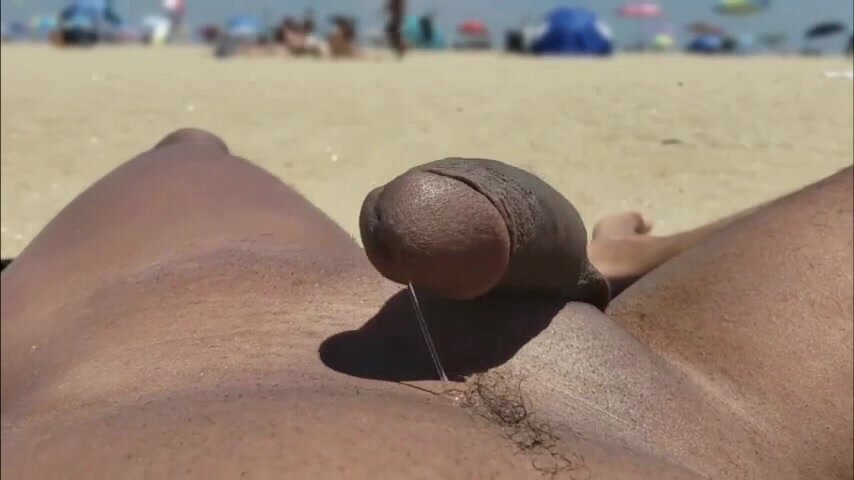 Showing off on the nude beach *leaking pre cum*