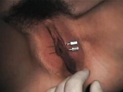 Girl gets needles through her labia then has them tied.