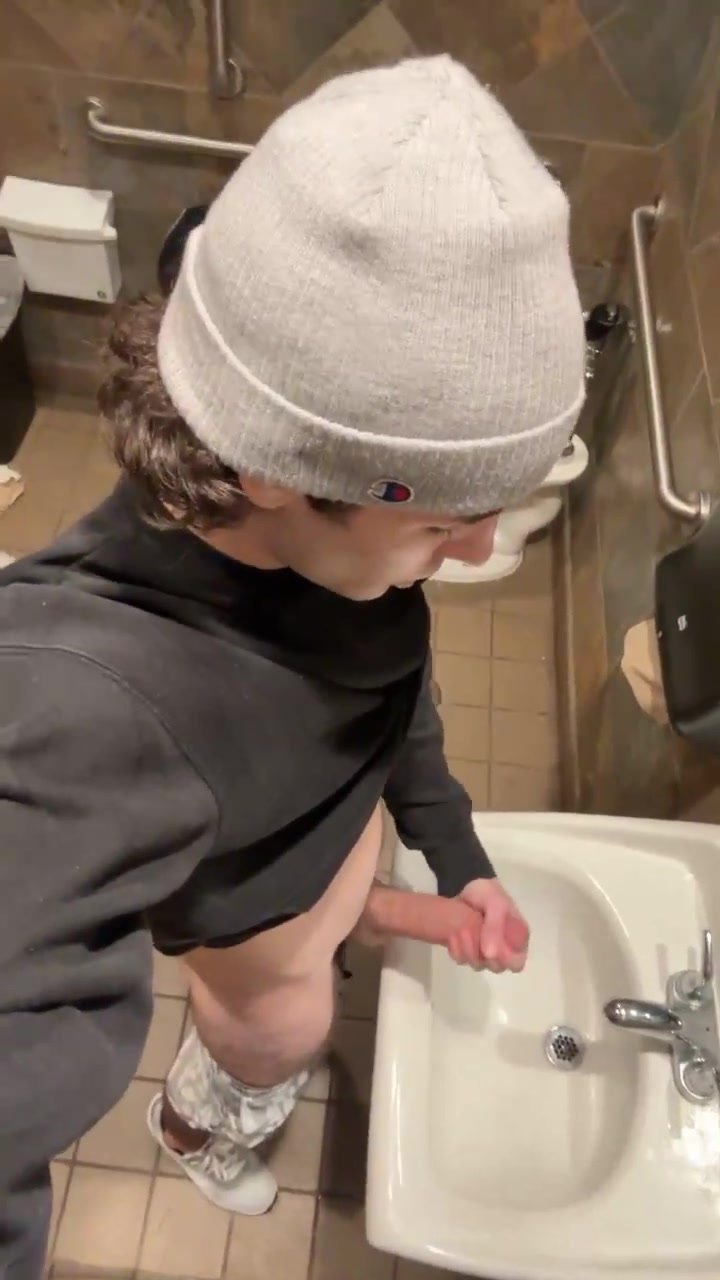 Cute guy strokes it in bathroom almost caught