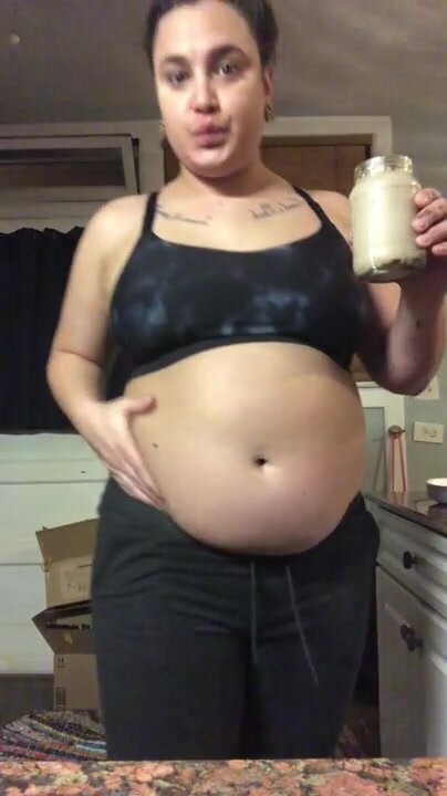 Girl chugging with big belly