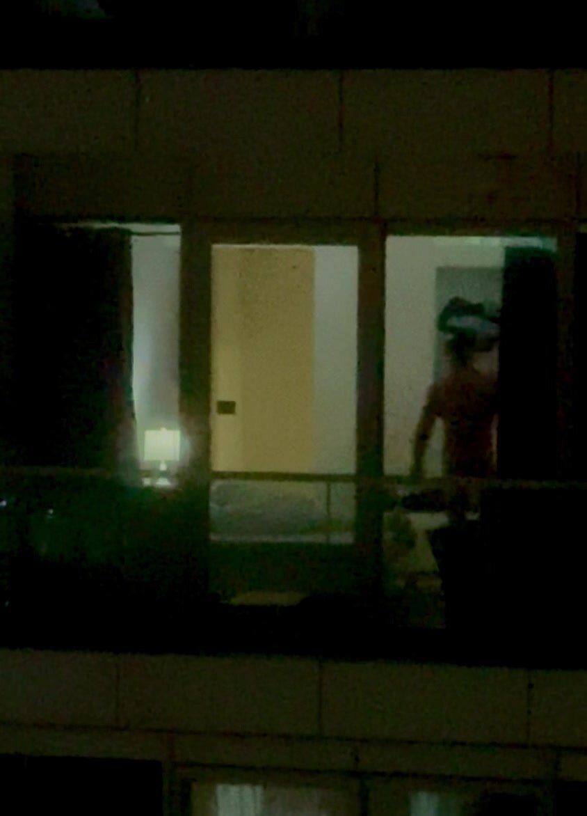 Curtains opened, neighbor naked