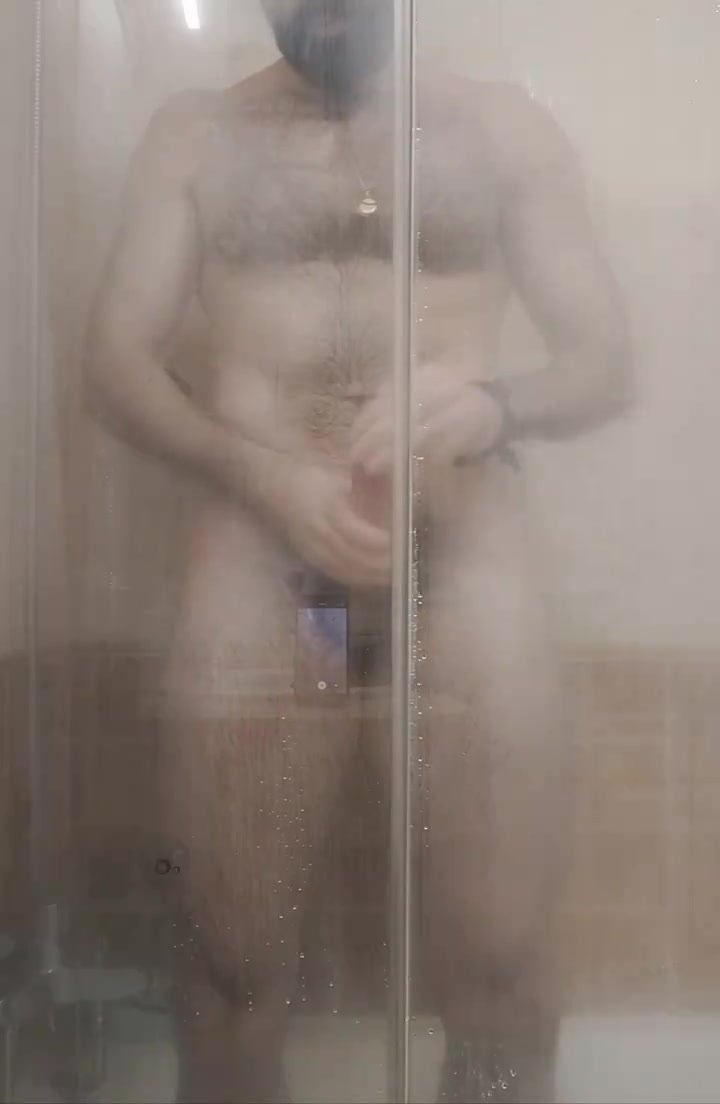 Uncut guy jerks off and teases in the hot steamy shower