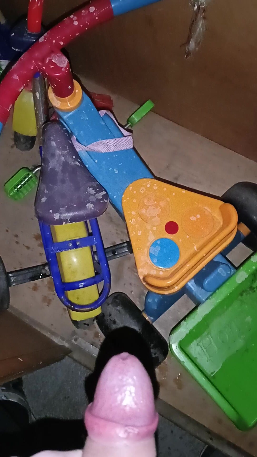 Guy pissing on someones toys in basement!