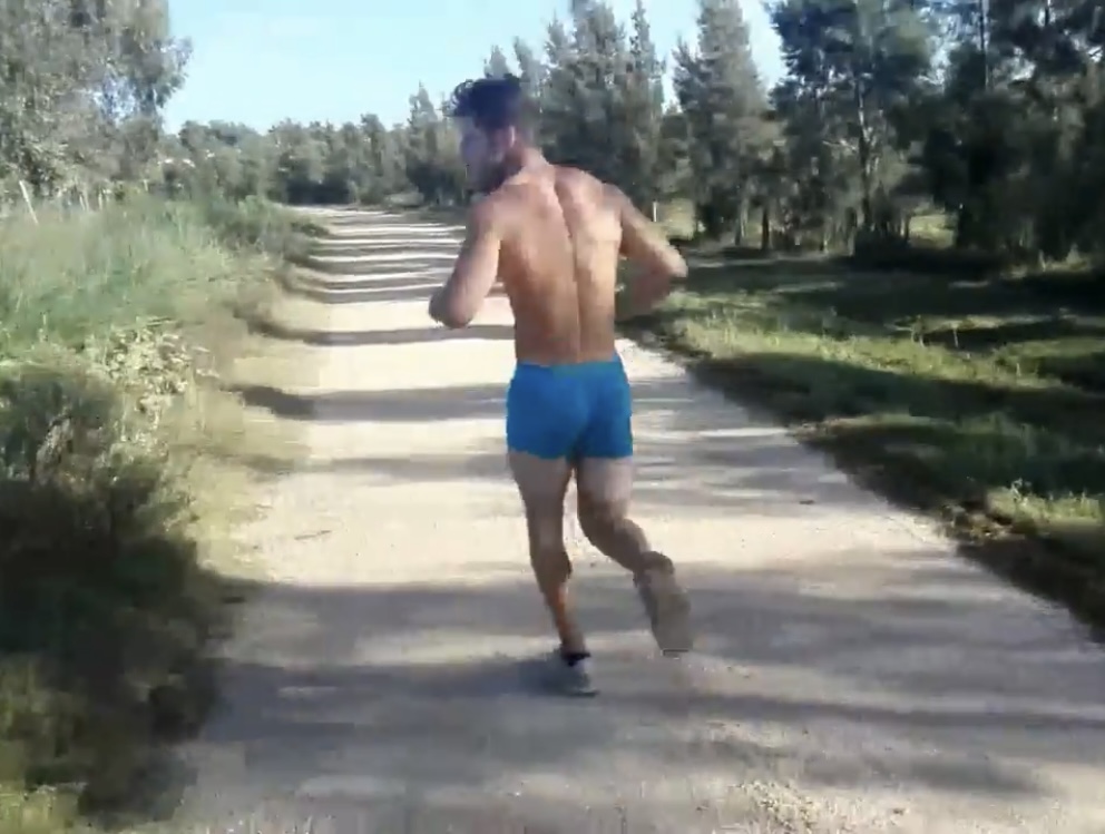Guy running in boxers on the street