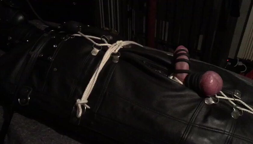 Bondage slave in leather sleepsack