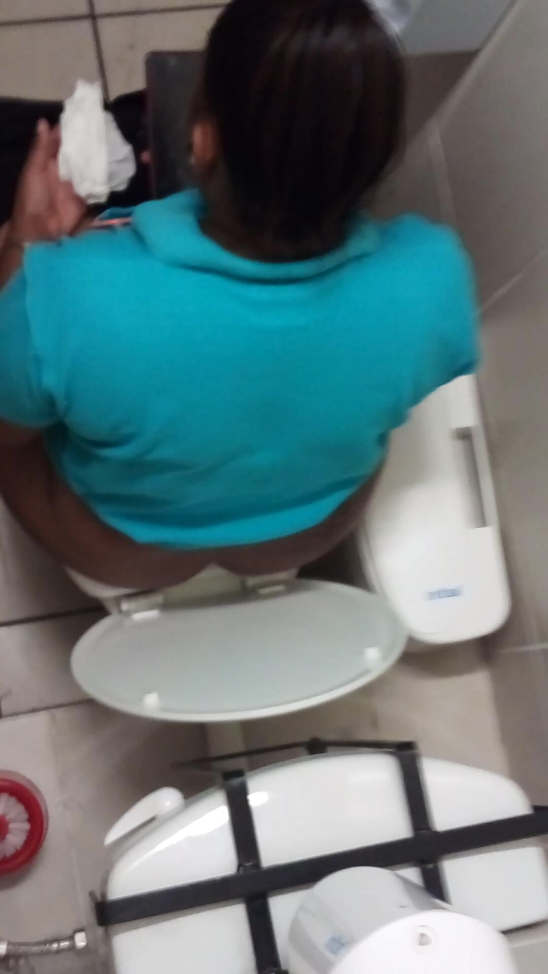 Filming a colleage from work peeing in the toilet