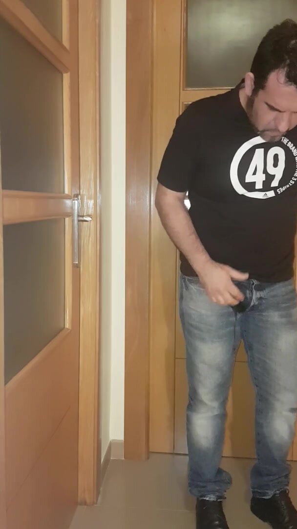 Sexy man pissing his jeans