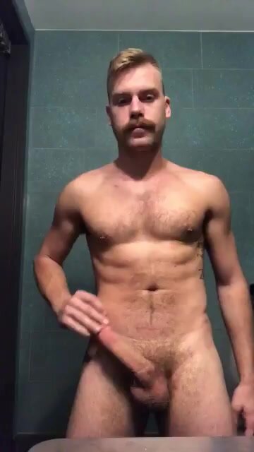 Blonde plays with dick in bathroom