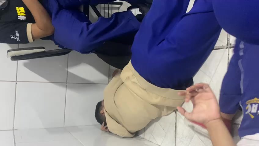 student rubbing herself on the floor
