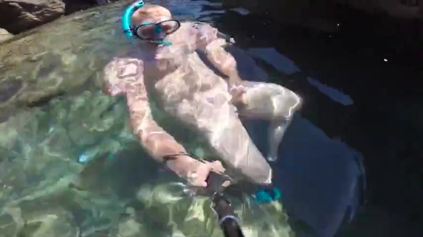 Swimming naked and feeding the fish