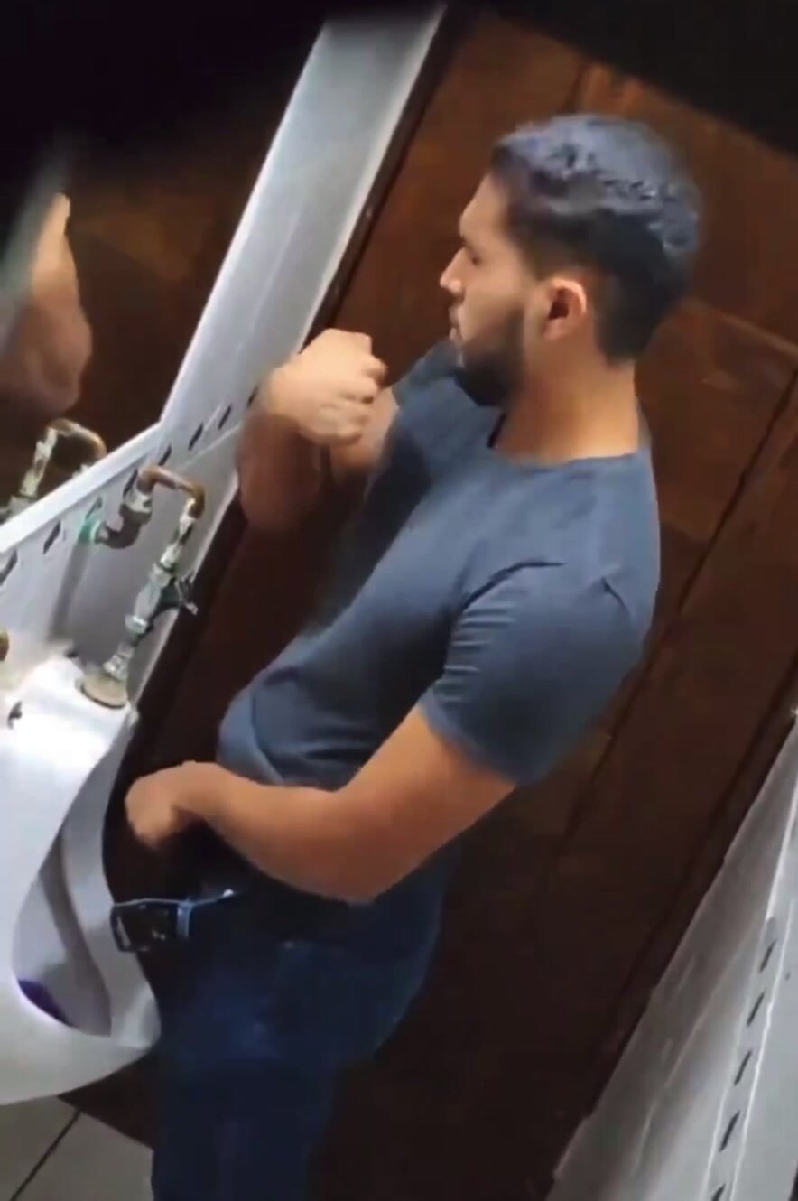 Sexy man is taking a piss