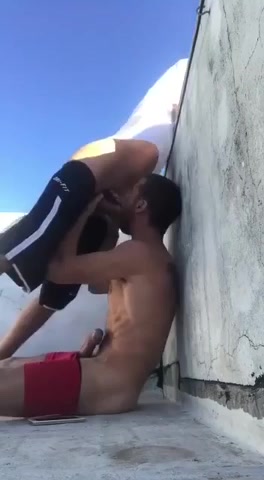 Sucking on a rooftop