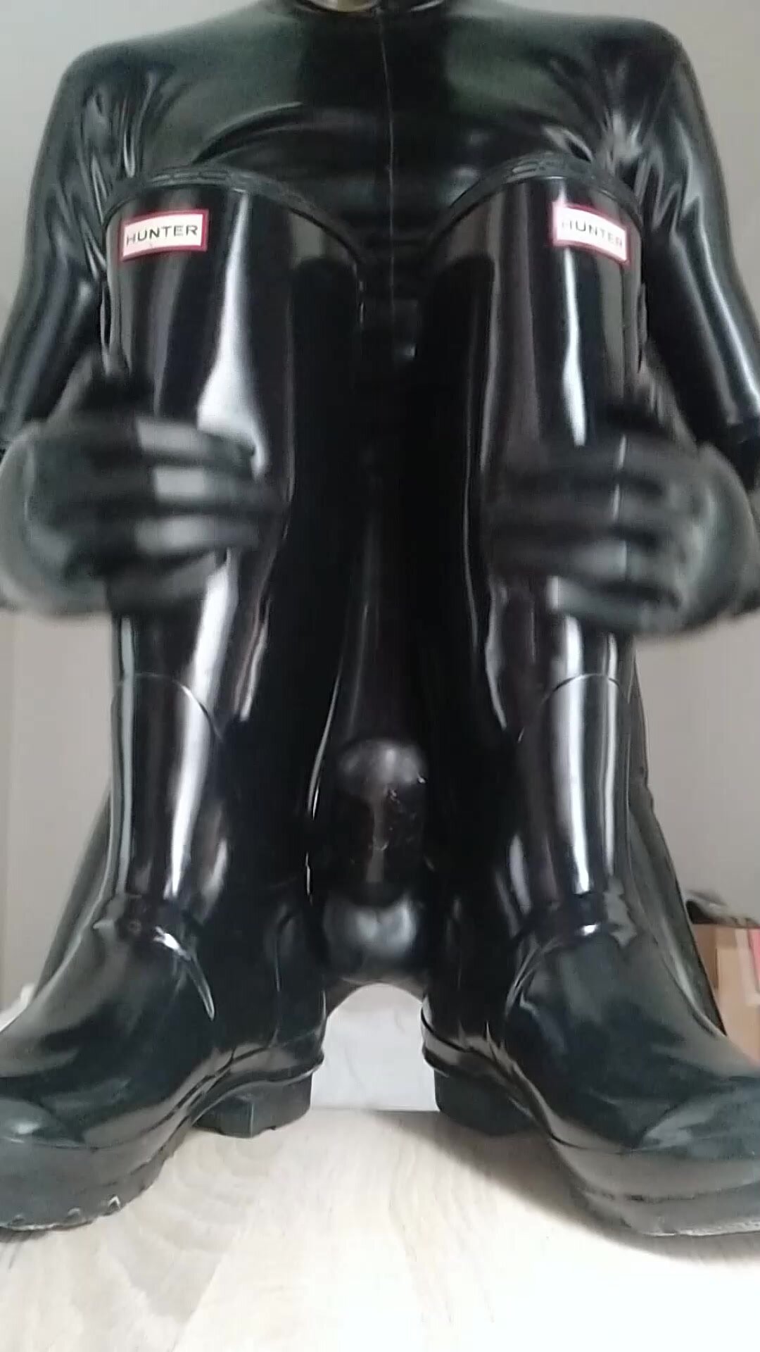 Play with shiny rubber boots