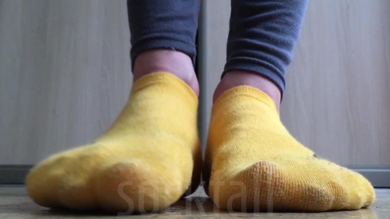Yellow ankle socks closeup on the floor