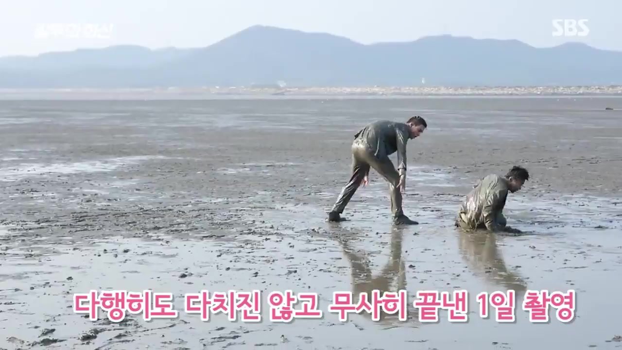 Korean dudes mud westling in suits