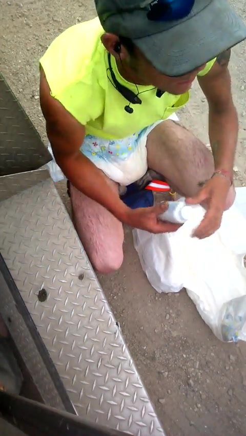 Guy Changes Diaper At Work